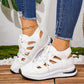 Pustende sneakers med snøring og utskjæringer