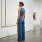 Ermeløs asymmetrisk omslags denim jumpsuit for kvinner