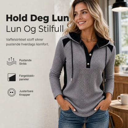 Avslappet hettegenser i vaffelstrikk med lappetekstur for kvinner